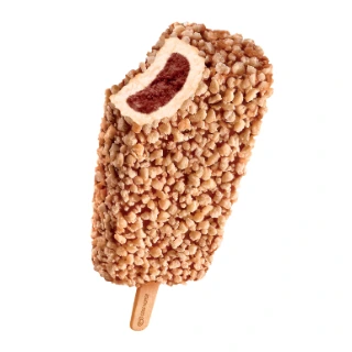 A crumb coated ice cream bar on a stick with a strawberry center