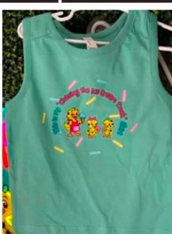 The same Chasing the Ice Cream Truck print on a mint green tank top